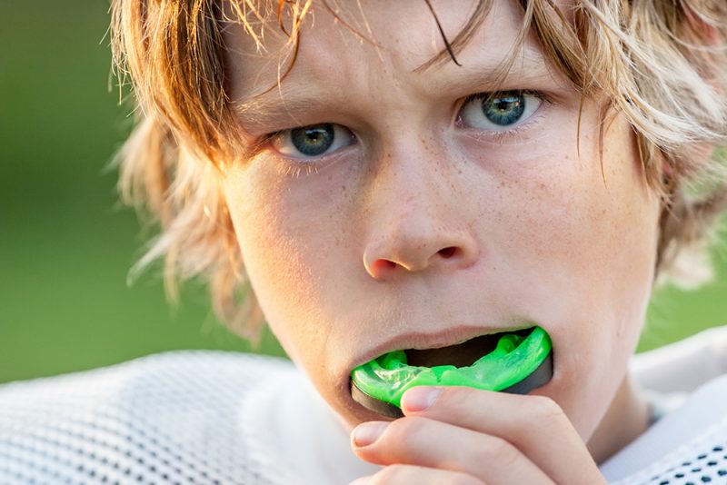 Boy with sports mouthguard